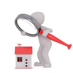 Un bonhomme avec une louche au-dessus d'une maison pour représenter le travail de l'expert immobilier